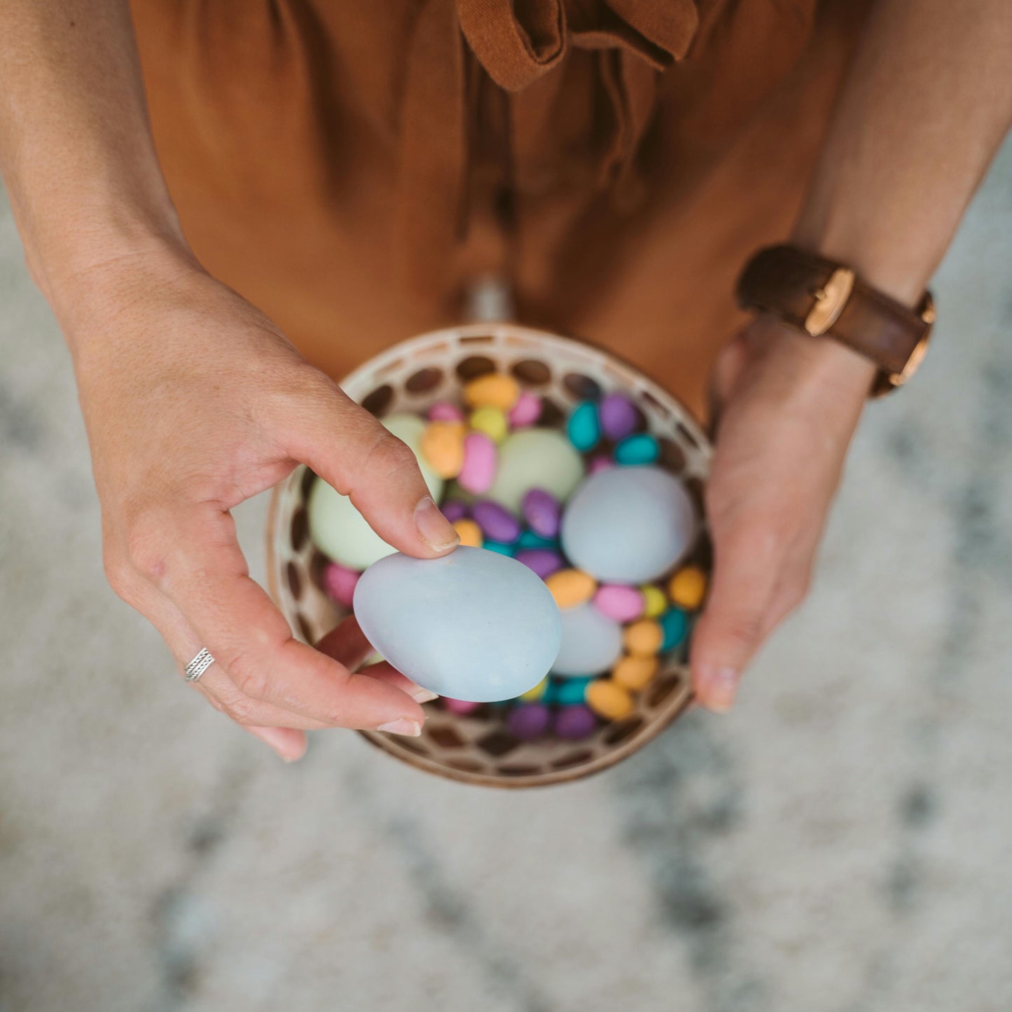 woman holding a coloured eggs ( easter eggs) 