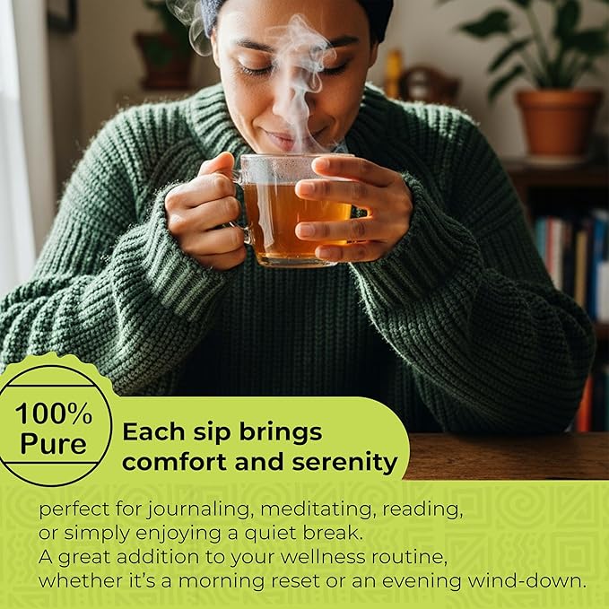 Man enjoying a hot cup of Akshit Soursop Leaf Herbal Tea with steam rising from the cup in a cozy home setting.