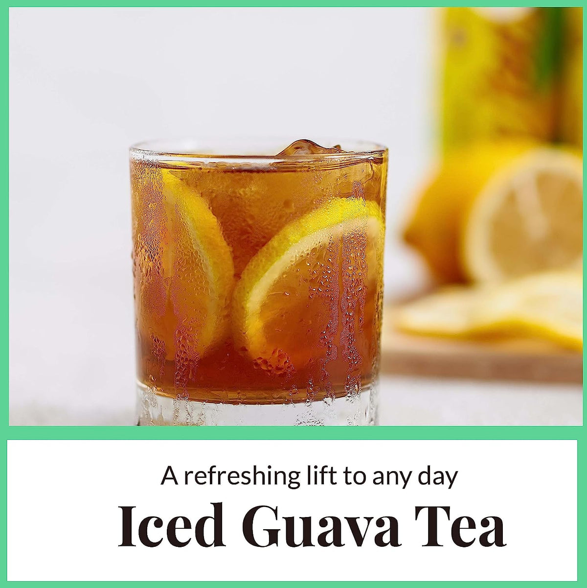 Glass of iced guava tea with lemon slices and condensation, showcasing refreshing cold herbal tea drink