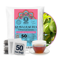 A package of guava leaf tea with a white bag, a stack of individual tea bags, and a glass cup of brewed tea, alongside a circular inset showing green guava fruits. The label features pink, blue, and orange graphics with the brand name 'akshit'.