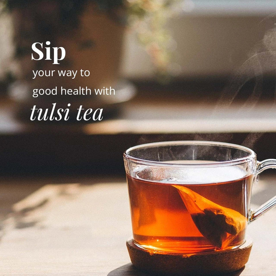 Tulsi tea in glass cup with tea bag herbal drink promoting wellness relaxation and natural health benefits warm soothing tea